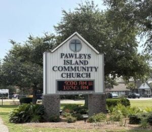 CU PI - NARSOL Church sign for Pawleys Island Community Church with service times 9:00 AM and 10:45 AM.